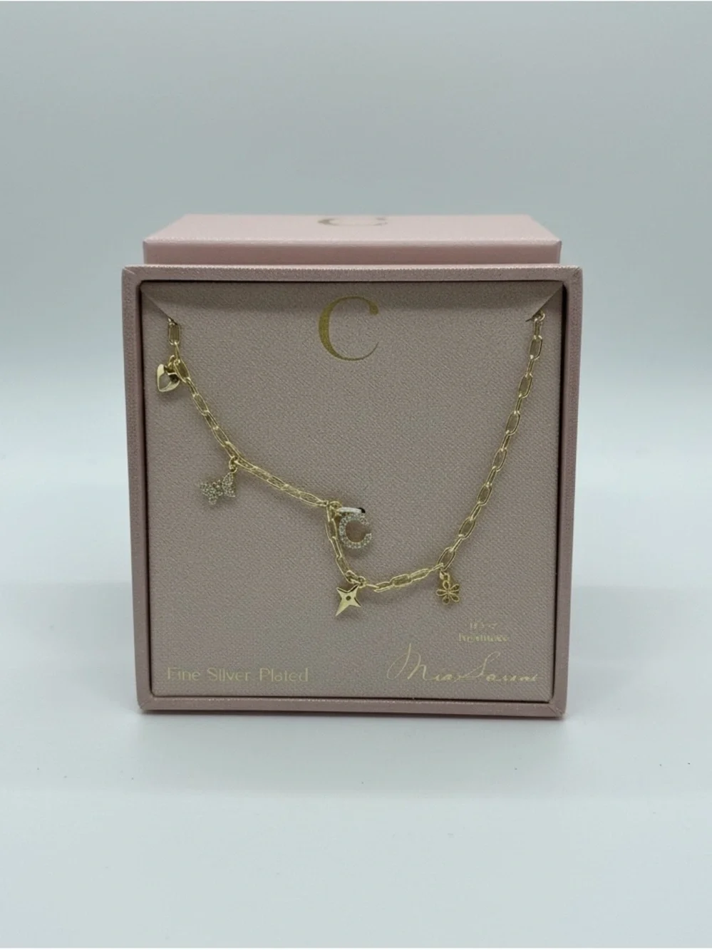 Fine plated necklace with C initial and cuties charm.